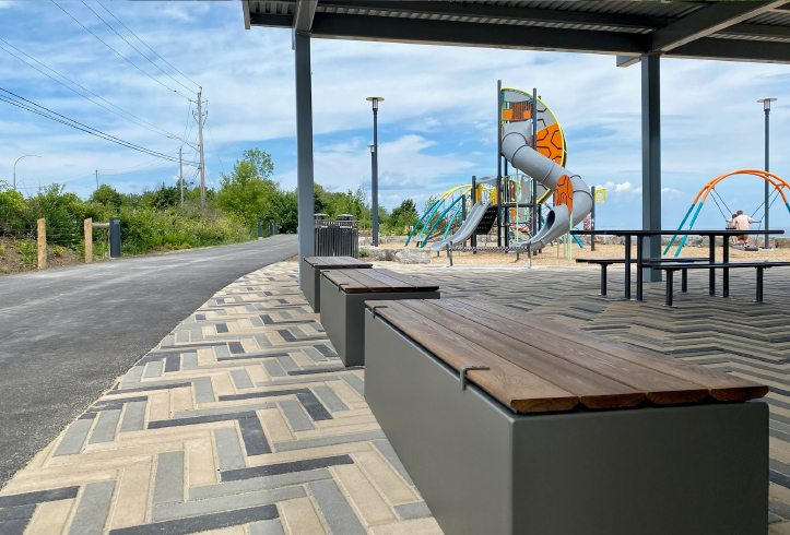 Green Theory Join Benches alongside a playground at Casablanca Waterfront Park in Grimsby.