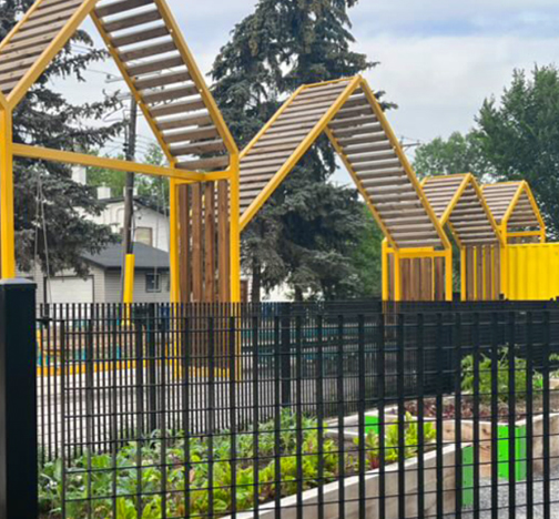 Omega 20 Grating Fence System surrounding a community garden at Bow to Bluff in Calgary.