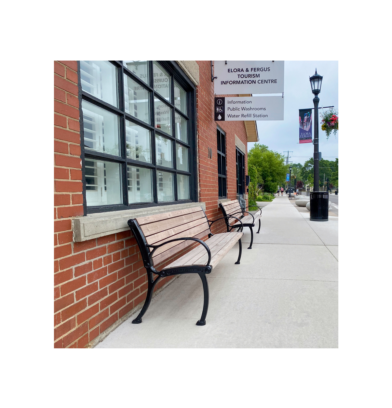 Victor Stanley benches in front of the information centre at the Elora East Mill streetscape.