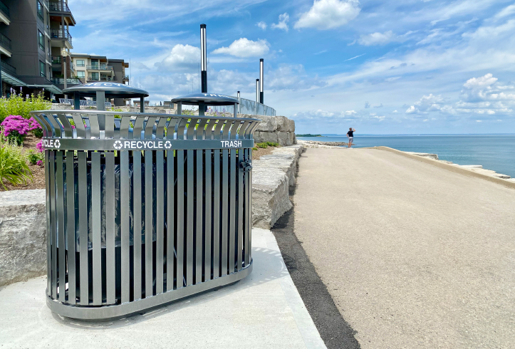 Victor Stanley SD-36 dual stream waste receptacle at the Casablanca waterfront promenade with a view of the lake in the background.