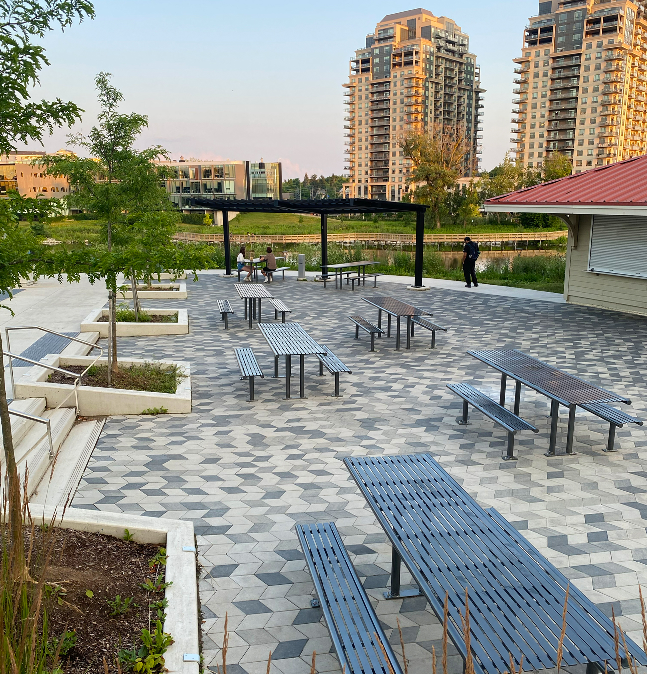 Victor Stanley tables in a picnic area overlooking Silver Lake at Waterloo Park.